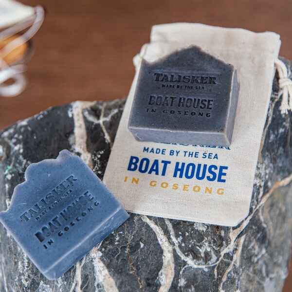 Diageo-Talisker-Boathouse-pop-up-store-PMG-4.jpg Two soap bars and a small pouch imprinted with Talisker Made by the Sea: Boathouse in Goseong.