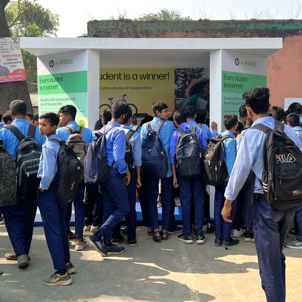 HP-Ryans-Computers-Every-student-is-a-winner-PMG-4.jpg Students in blue uniforms exploring the HP x Ryans Computers event booth.