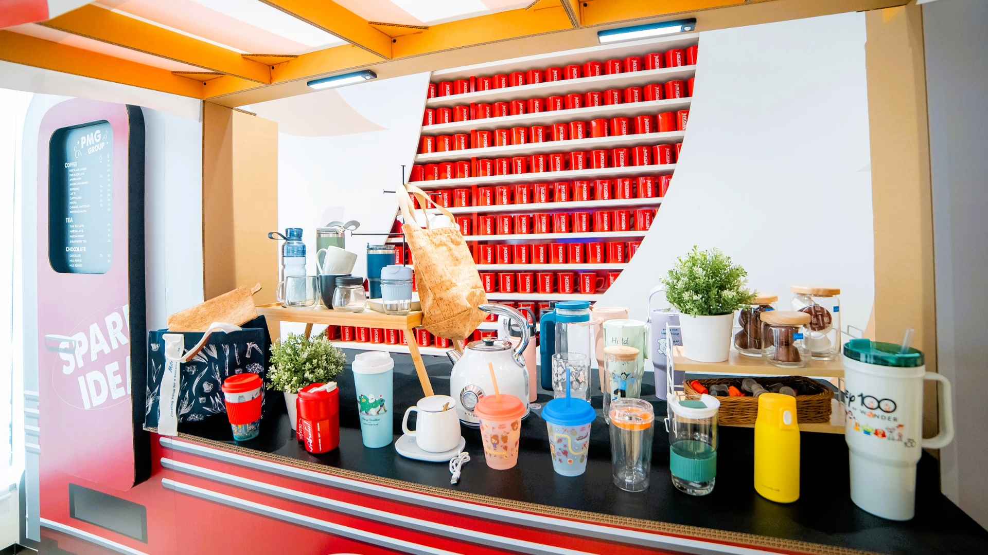 A red and white counter featuring various tumblers with temperature-sensitive, colour-changing features.